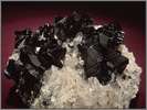 Black Cassitorite Crystals With White Quartz
